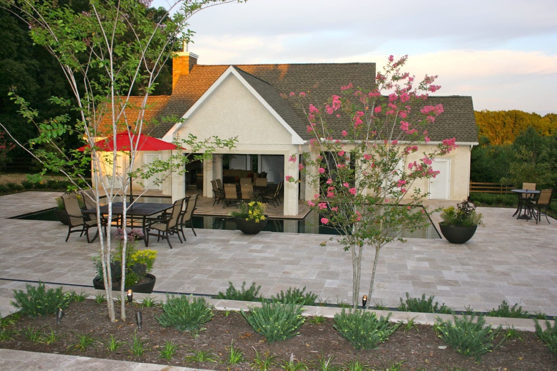 Luxury outdoor living and poolscape by Field of Dreams