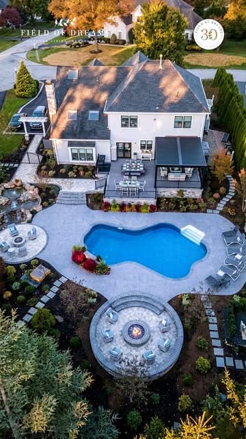 Field of Dreams Instagram reel: aerial of a custom pool, patio, and fire pit
