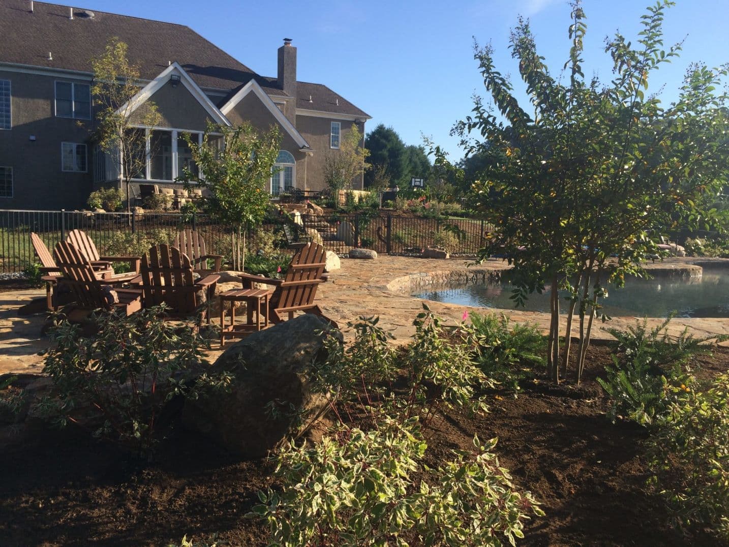 Natural freeform pool built into an open Maryland-Pennsylvania landscape