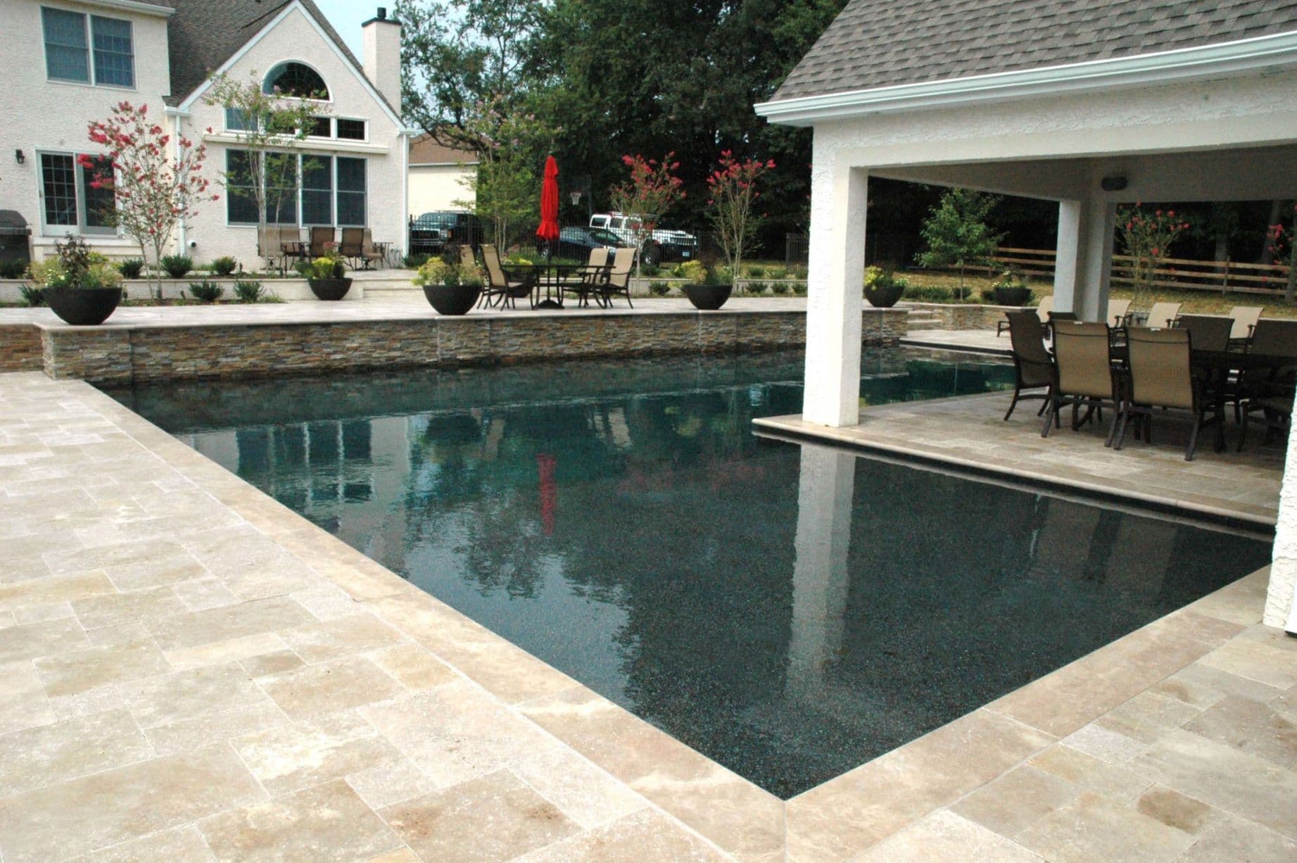 Pavilion dining beside a custom pool