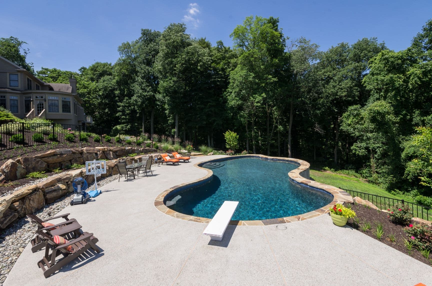 Integrated pool, patio, and landscape by Field of Dreams