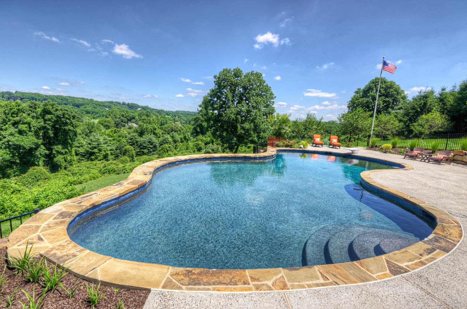Integrated pool, patio, and landscape by Field of Dreams