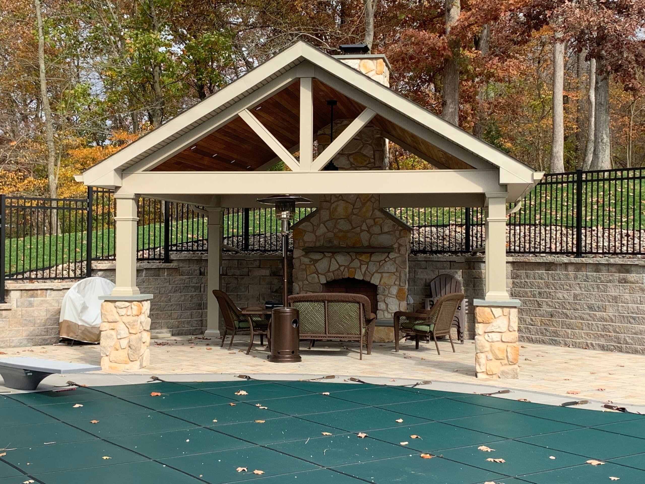 Stone fireplace outdoor living by Field of Dreams